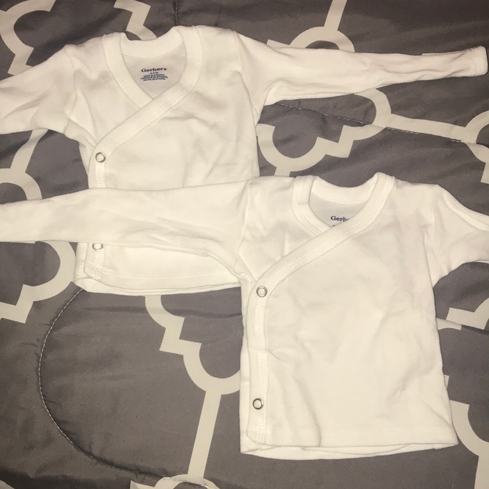 Two white baby shirts